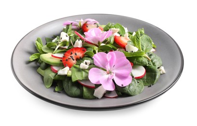 Photo of Fresh spring salad with flowers in plate isolated on white