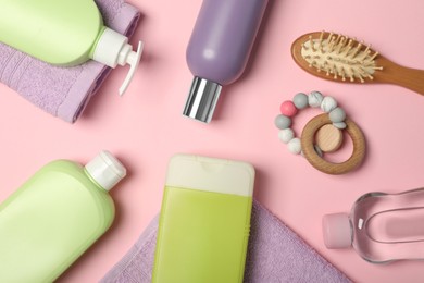 Flat lay composition with baby cosmetic products on pink background