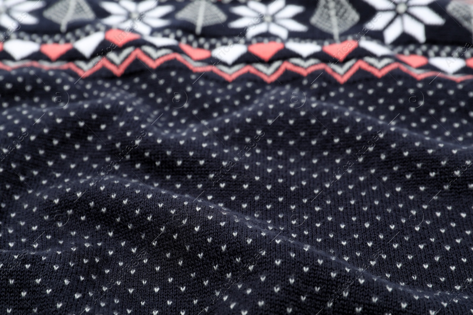 Photo of Texture of cozy warm sweater as background, closeup