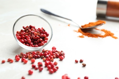 Ground red pepper and corns on marble table