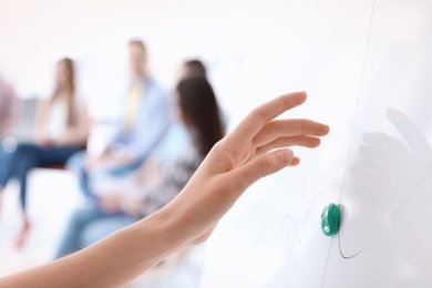 Photo of Female business trainer giving lecture in office, closeup