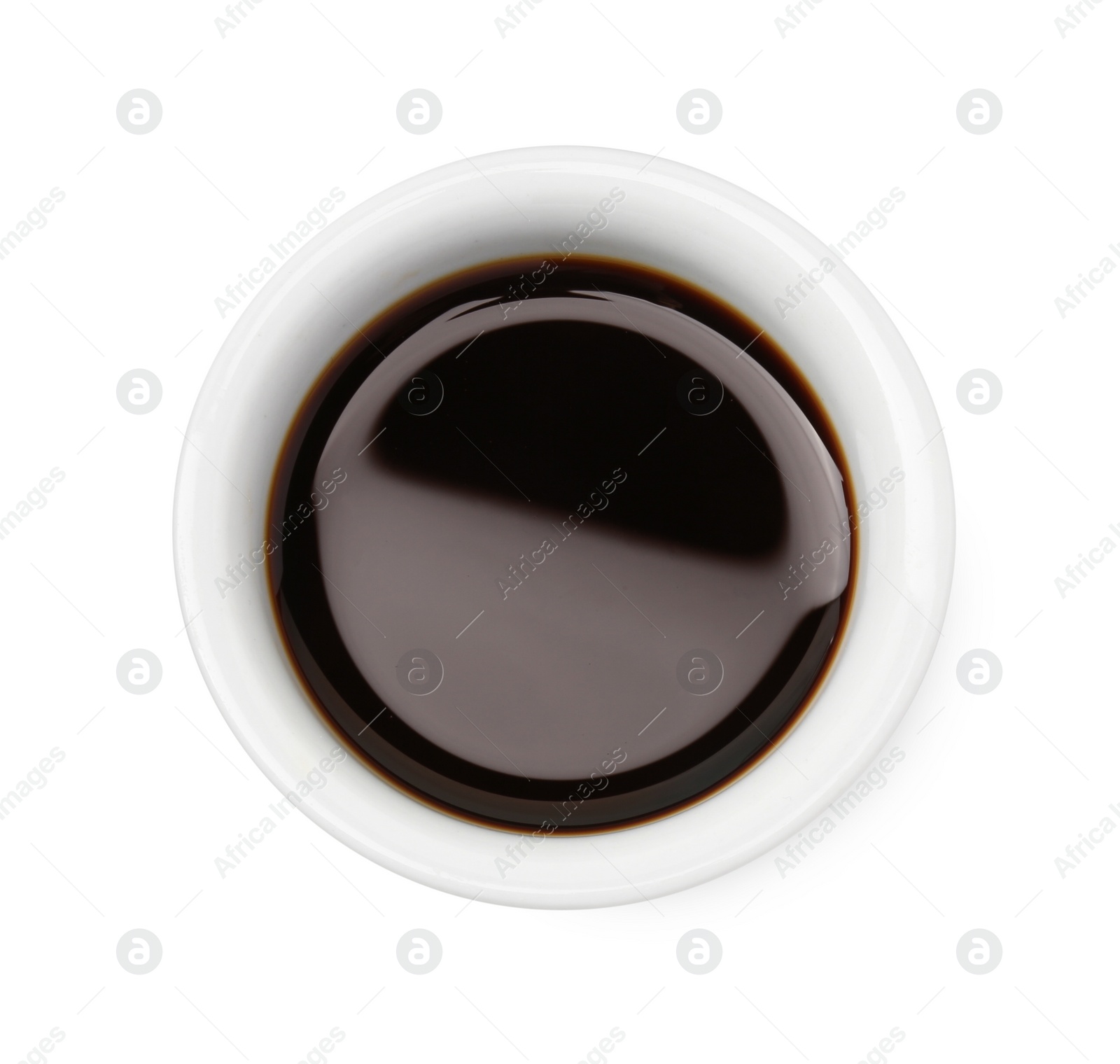 Photo of Tasty soy sauce in bowl isolated on white, top view