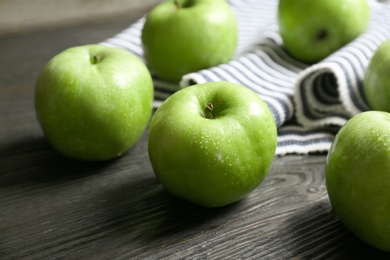 Photo of Fresh green apples on wooden table