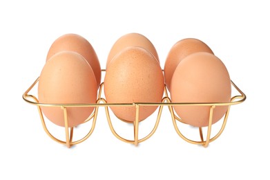 Photo of Golden metal egg tray on white background