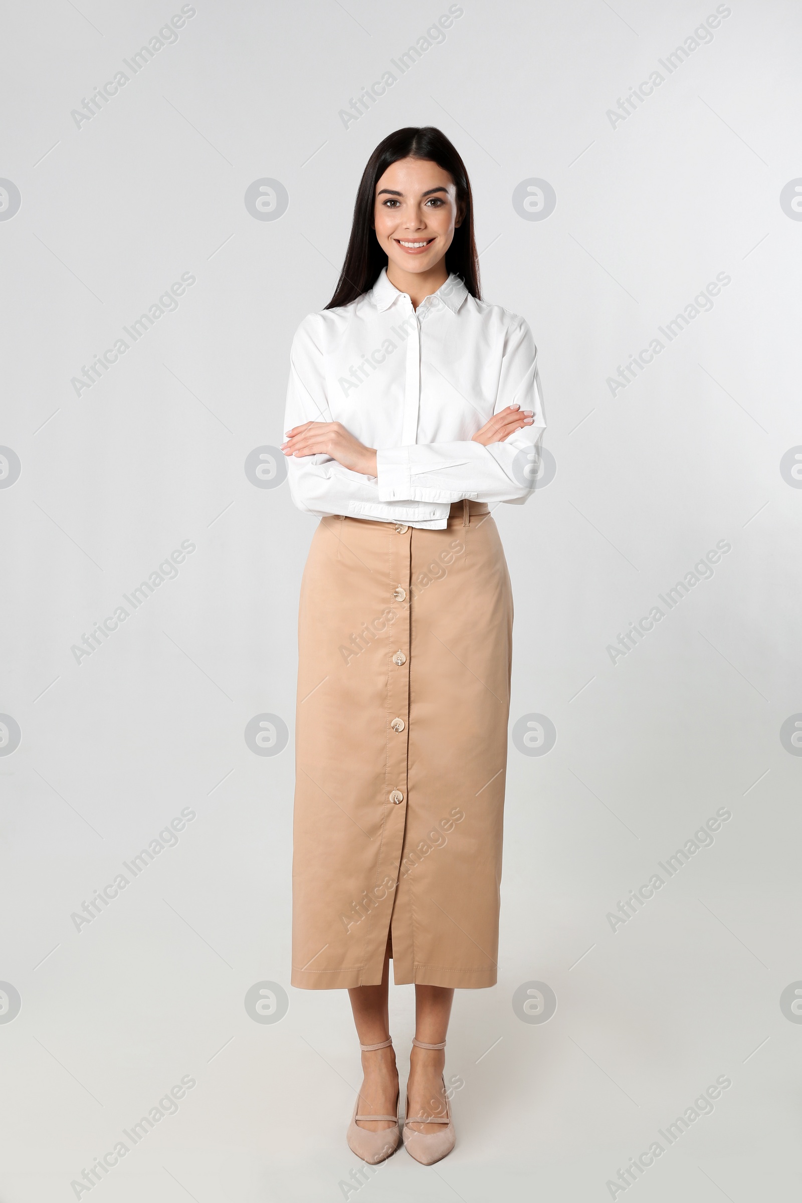 Photo of Full length portrait of young businesswoman on white background