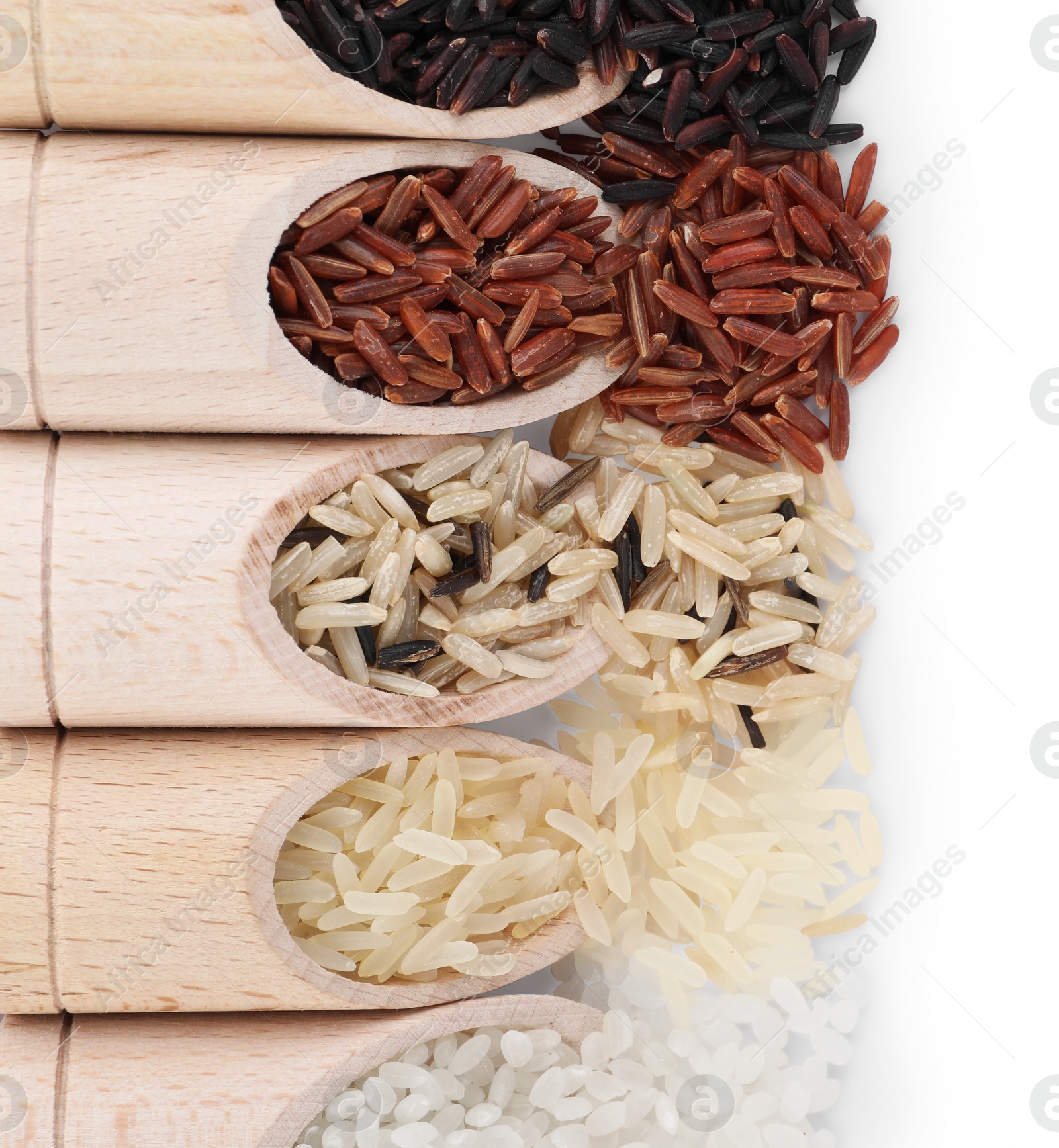 Photo of Different sorts of rice in scoops isolated on white, top view