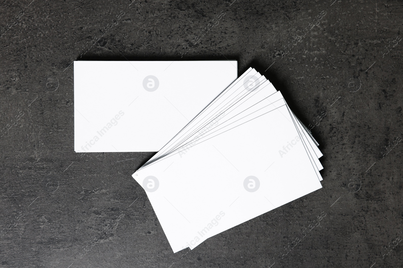 Photo of Blank business cards on grey textured background, top view. Mockup for design