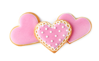 Photo of Decorated heart shaped cookies on white background, top view