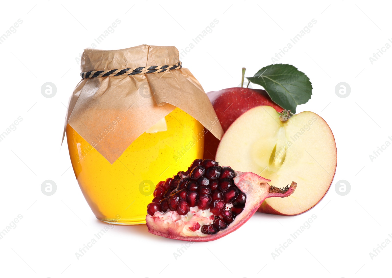 Photo of Honey, apples and pomegranate seeds on white background. Rosh Hashanah holiday