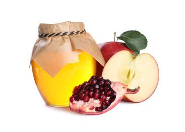 Photo of Honey, apples and pomegranate seeds on white background. Rosh Hashanah holiday