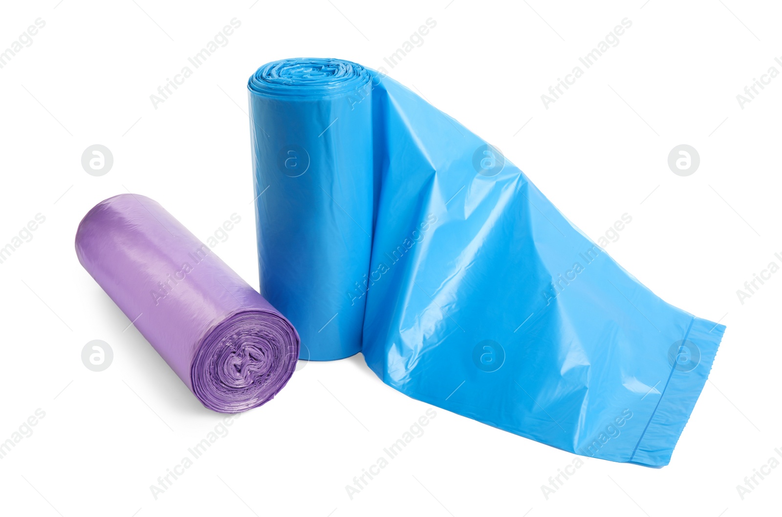 Photo of Rolls of different garbage bags on white background. Cleaning supplies