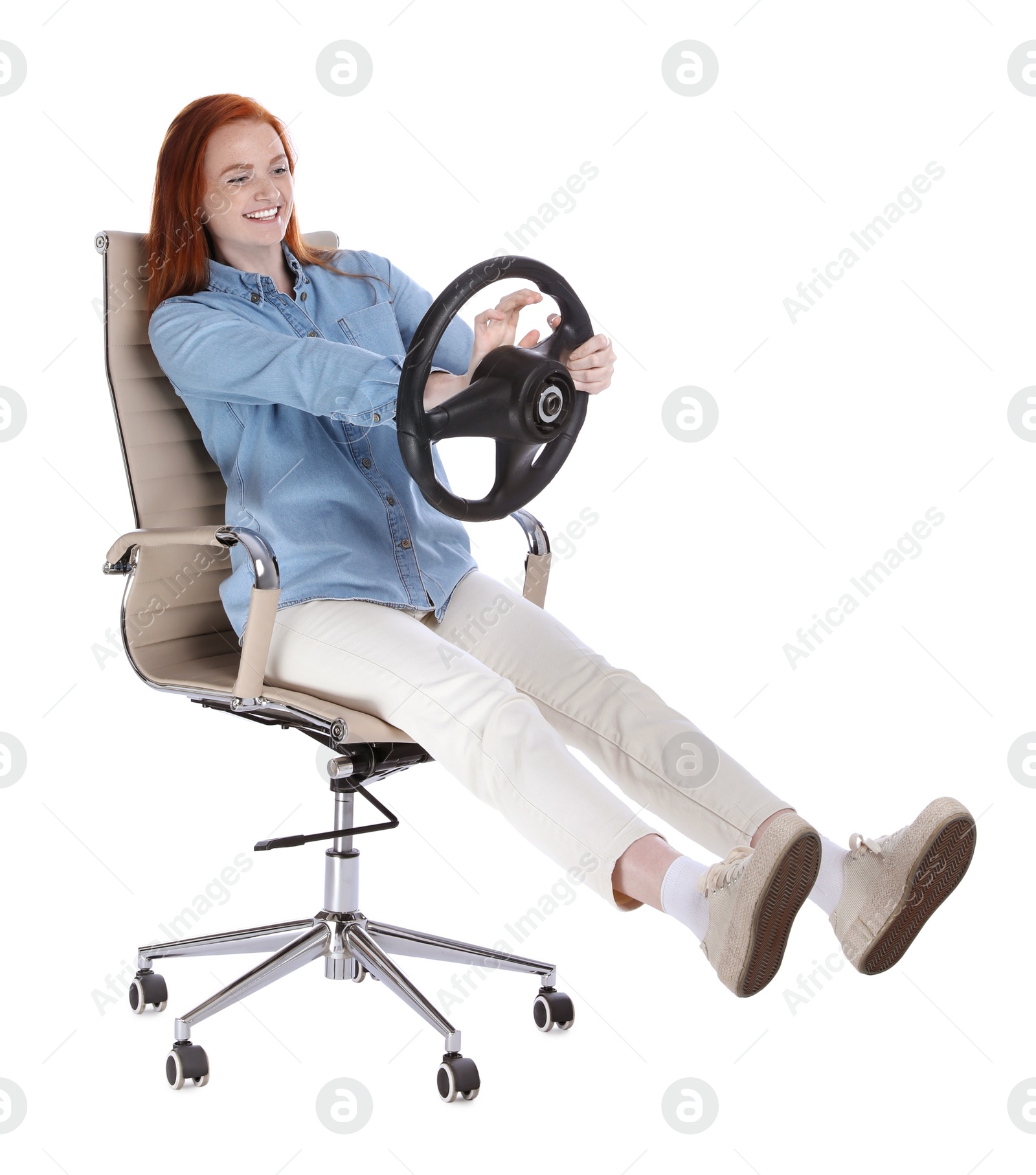 Photo of Happy young woman on chair with steering wheel against white background