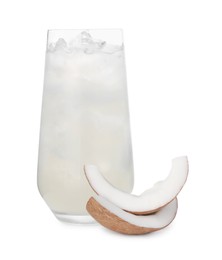 Photo of Glass of coconut water, ice cubes and nut isolated on white