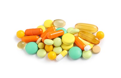 Photo of Heap of different colorful pills isolated on white