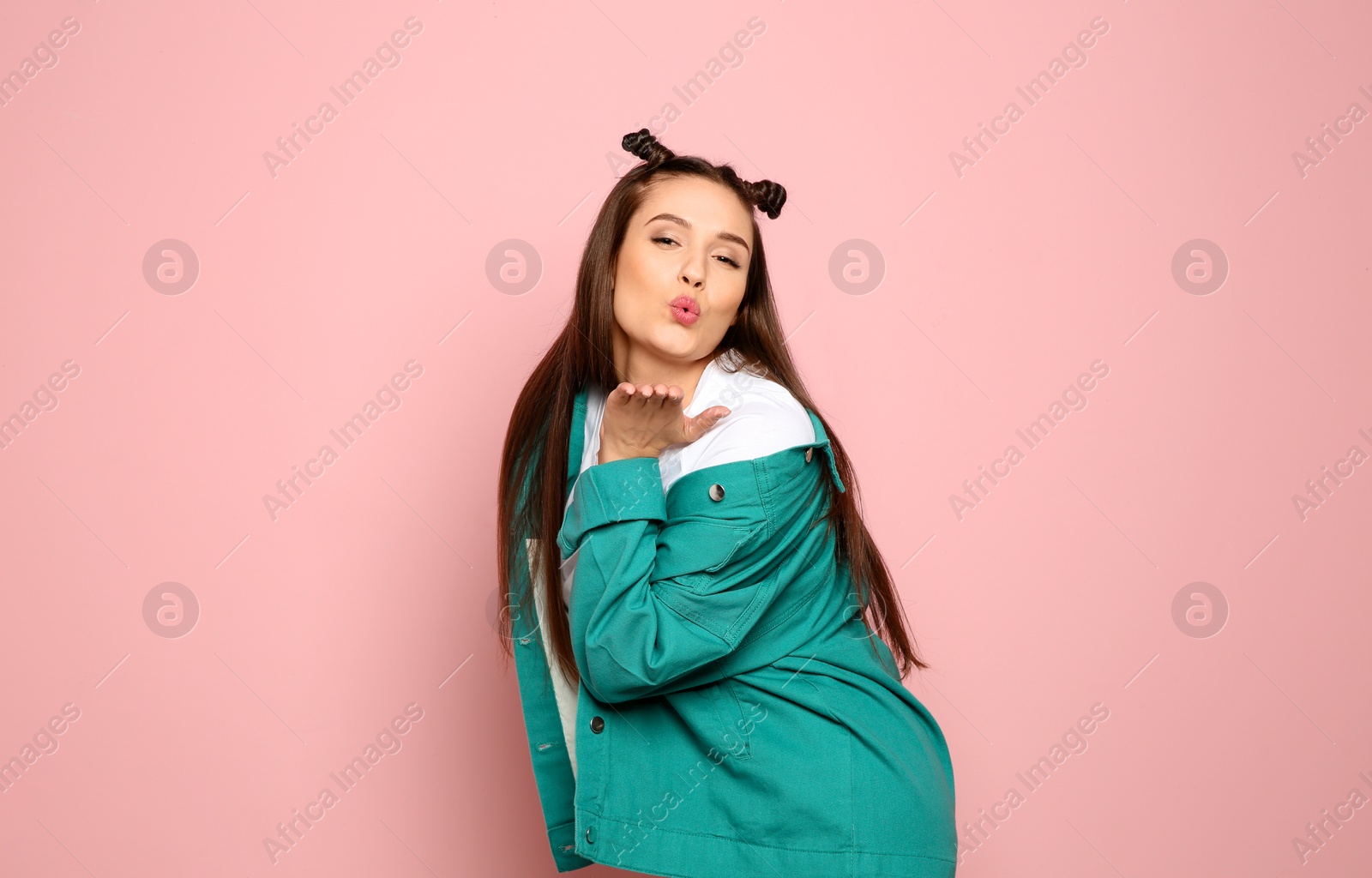 Photo of Portrait of beautiful young woman in stylish clothes on color background