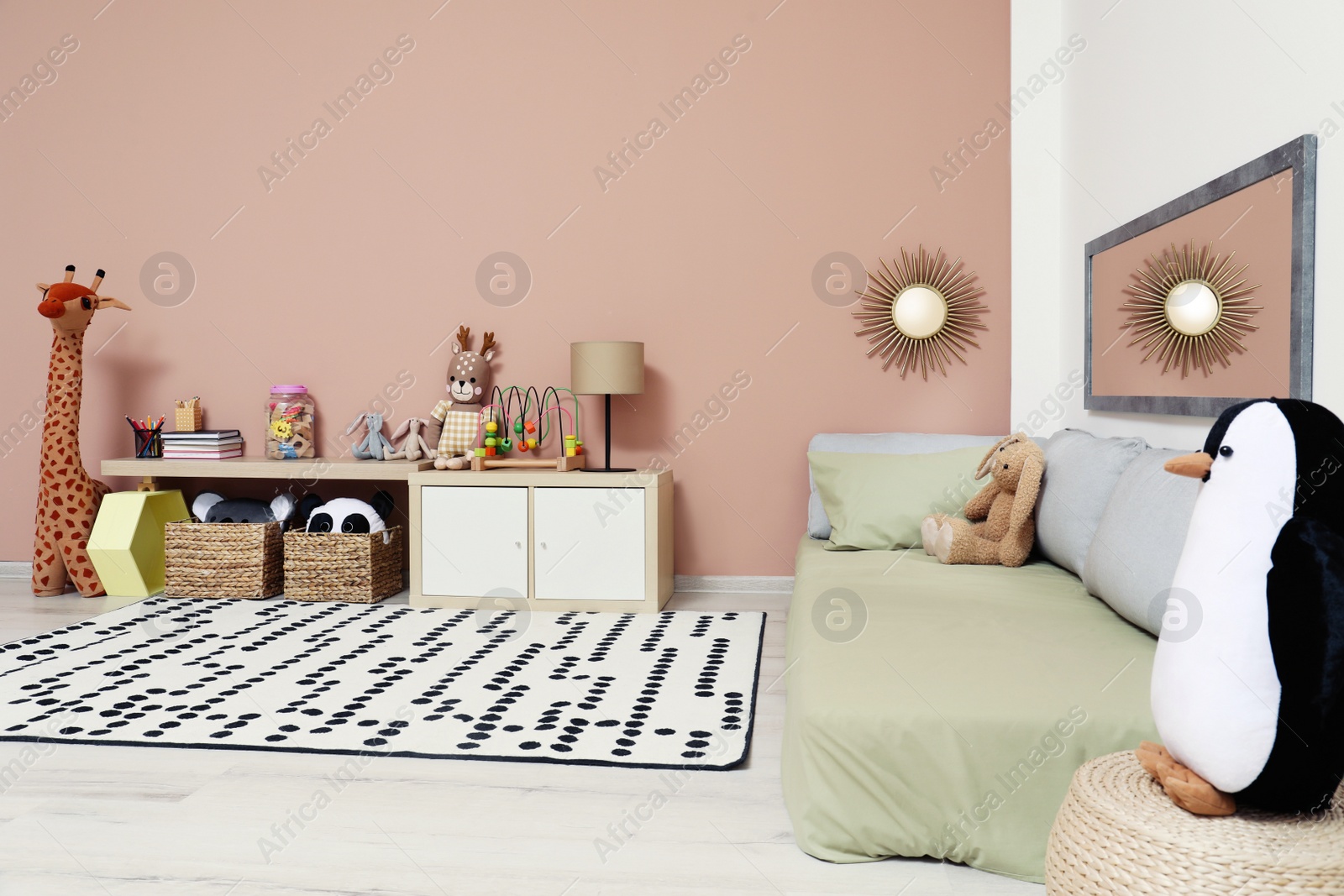 Photo of Montessori bedroom interior with floor bed and toys