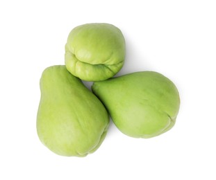 Photo of Many fresh green chayote isolated on white, top view