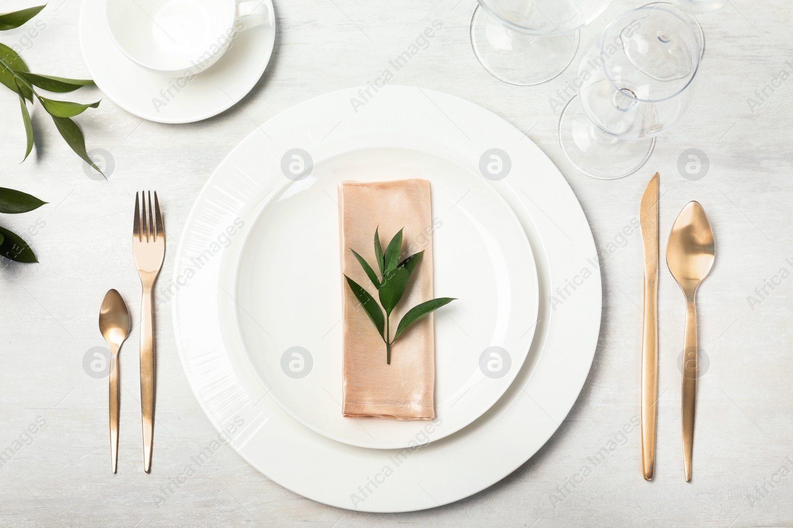 Photo of Beautiful table setting with cutlery, napkin and dinnerware on grey background, top view