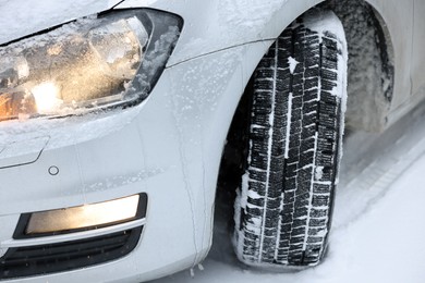 Photo of Car with winter tires on snowy road