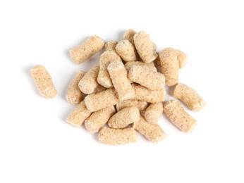 Photo of Pile of granulated wheat bran on white background, top view