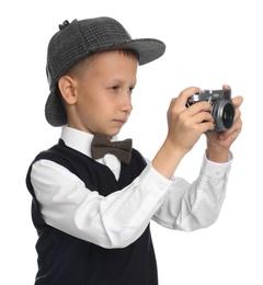 Photo of Cute little detective with vintage camera on white background