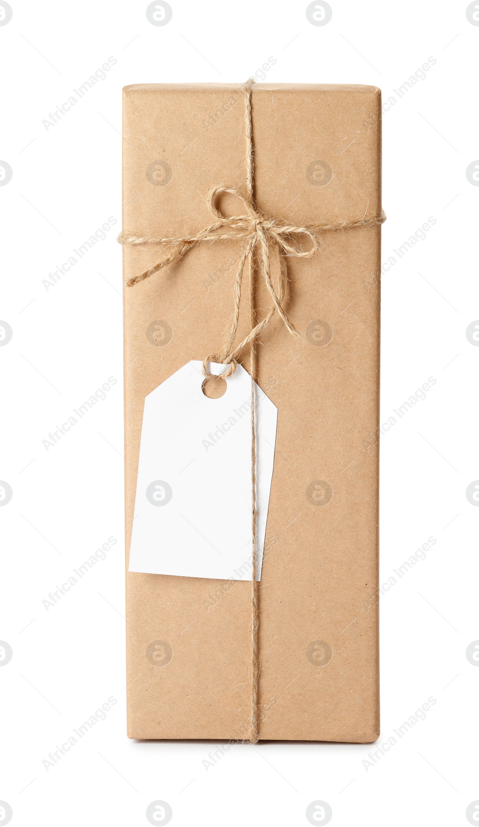 Photo of Gift box wrapped in kraft paper with bow and tag isolated on white