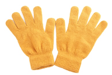 Photo of Yellow woolen gloves on white background, flat lay. Winter clothes