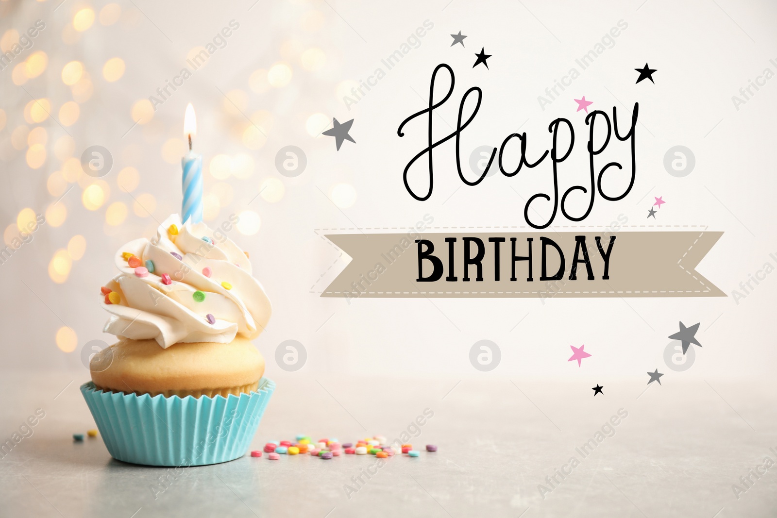 Image of Happy Birthday! Delicious cupcake with candle on light table