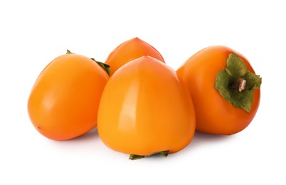 Photo of Delicious ripe juicy persimmons on white background