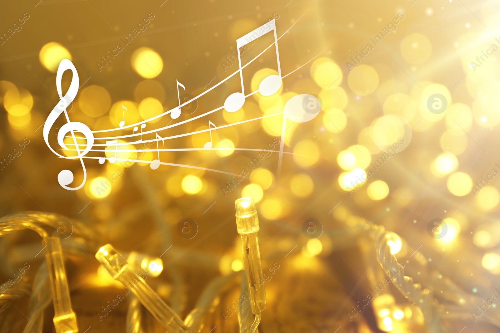 Image of Music notes and Christmas lights, bokeh effect.