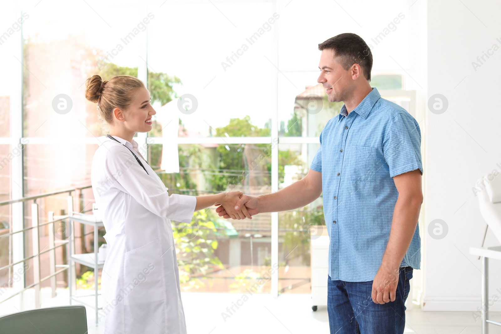 Photo of Patient having appointment with doctor in hospital