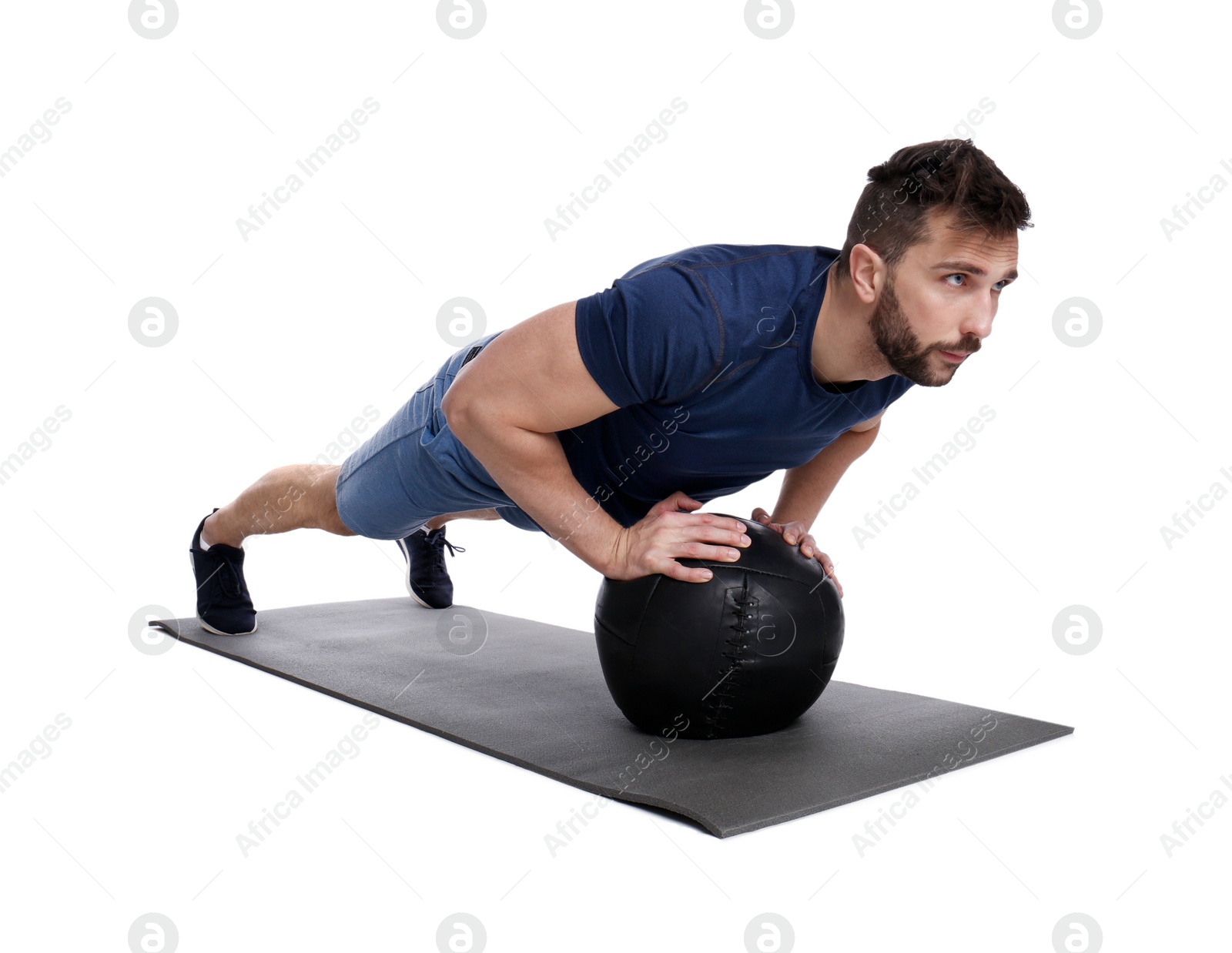 Photo of Athletic man doing exercise with medicine ball isolated on white