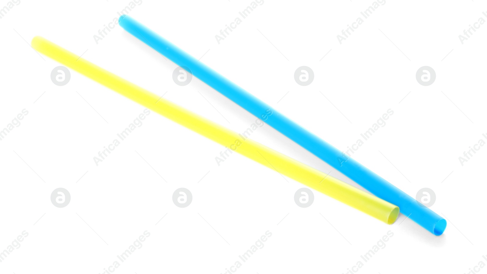 Photo of Color plastic cocktail tubes on white background