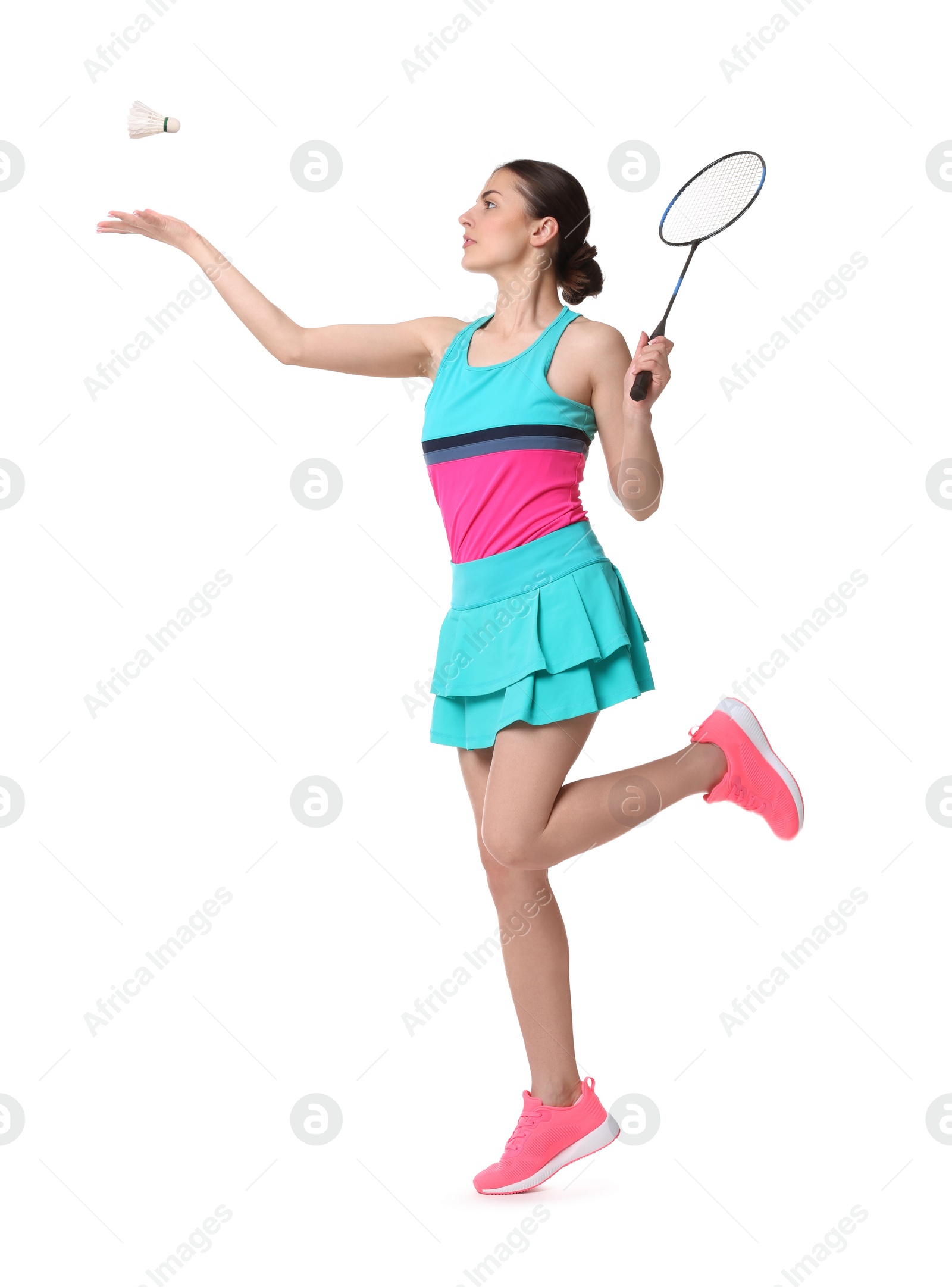 Photo of Young woman playing badminton with racket on white background