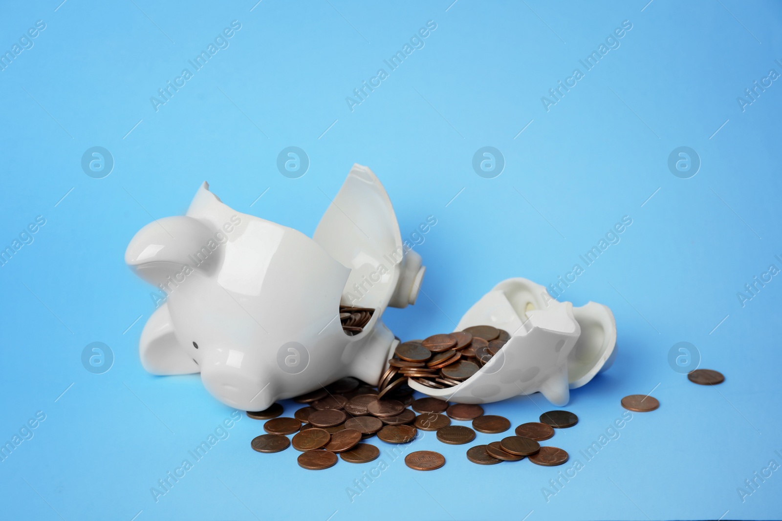 Photo of Broken piggy bank with coins on color background