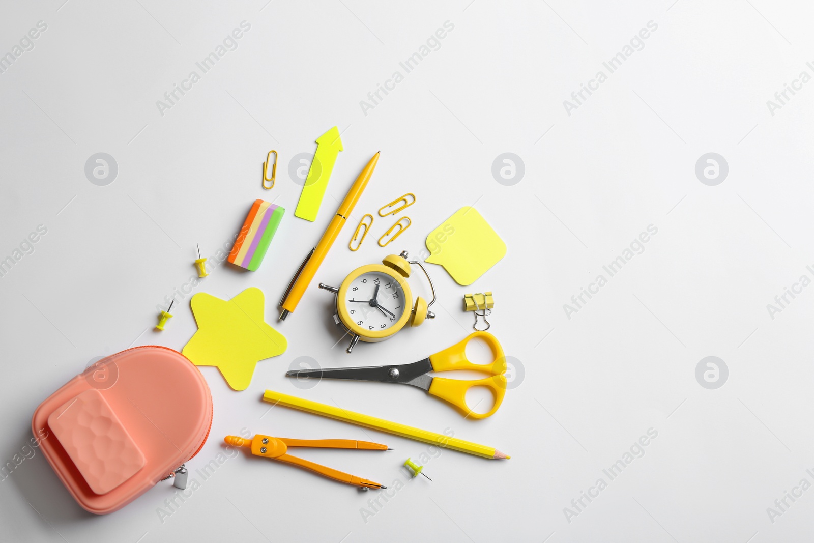 Photo of Flat lay composition with school stationery on white background, space for text. Back to school