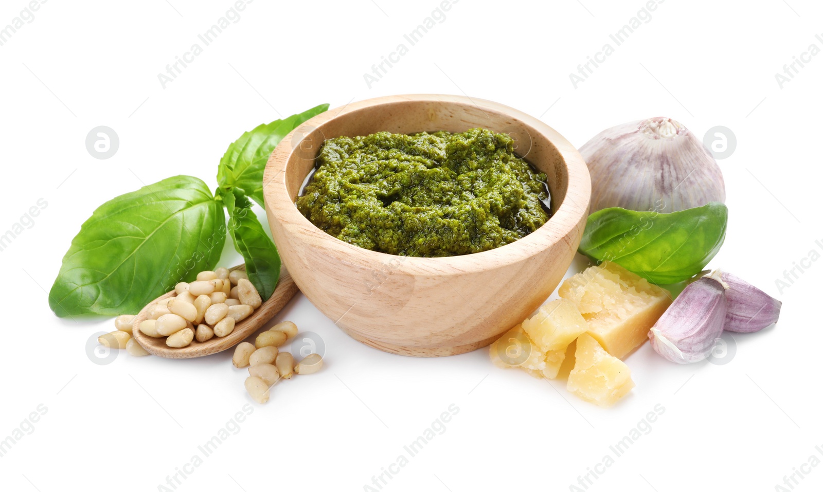 Photo of Fresh tasty pesto sauce and ingredients isolated on white