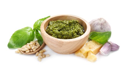 Fresh tasty pesto sauce and ingredients isolated on white