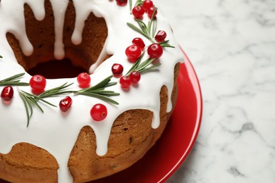 Photo of Traditional homemade Christmas cake on white marble table, closeup