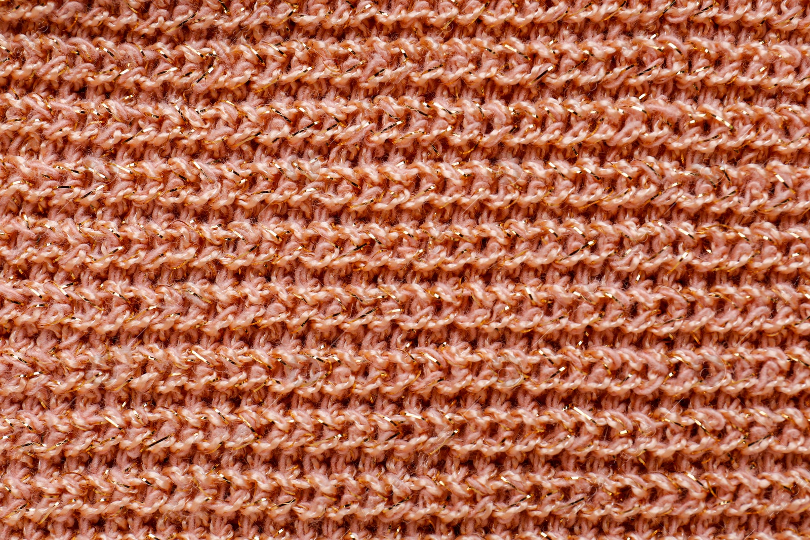 Photo of Brown knitted fabric as background, top view