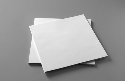 Photo of Stack of blank paper sheets for brochure on light grey background