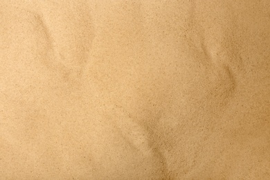 Photo of Dry beach sand as background, top view