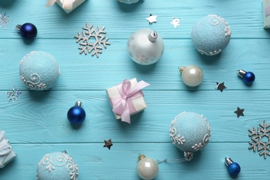 Flat lay composition with Christmas decorations on blue wooden background. Winter season