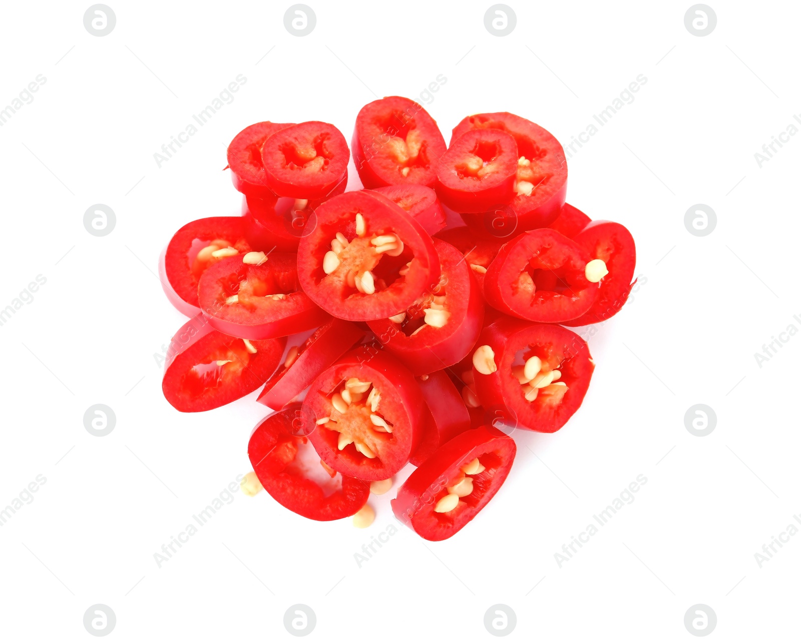 Photo of Pile of cut chili peppers on white background, top view