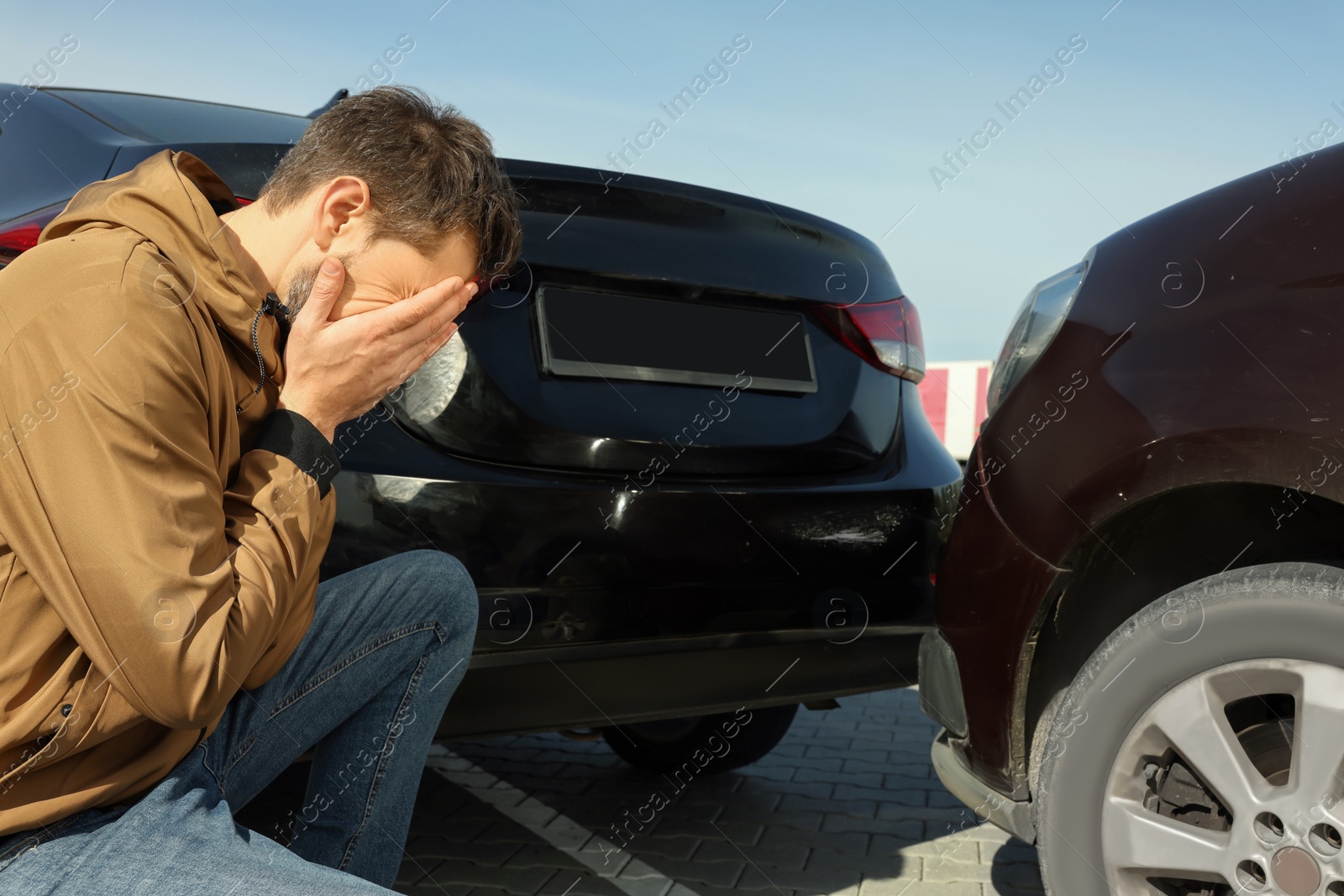 Photo of Stressed man near car with scratch outdoors. Auto accident