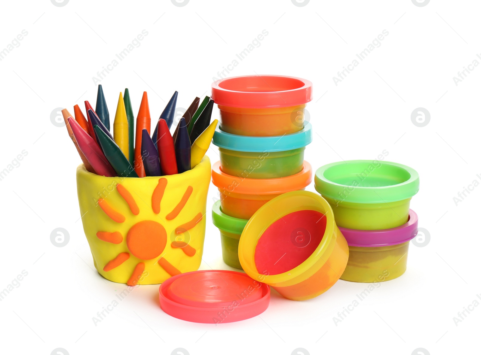 Photo of Set of bright play dough with colorful pencils on white background