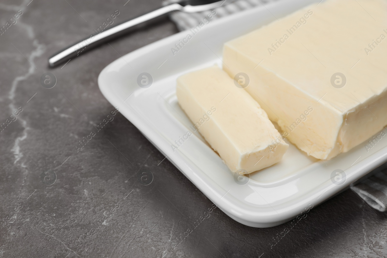 Photo of Plate with tasty fresh butter on table