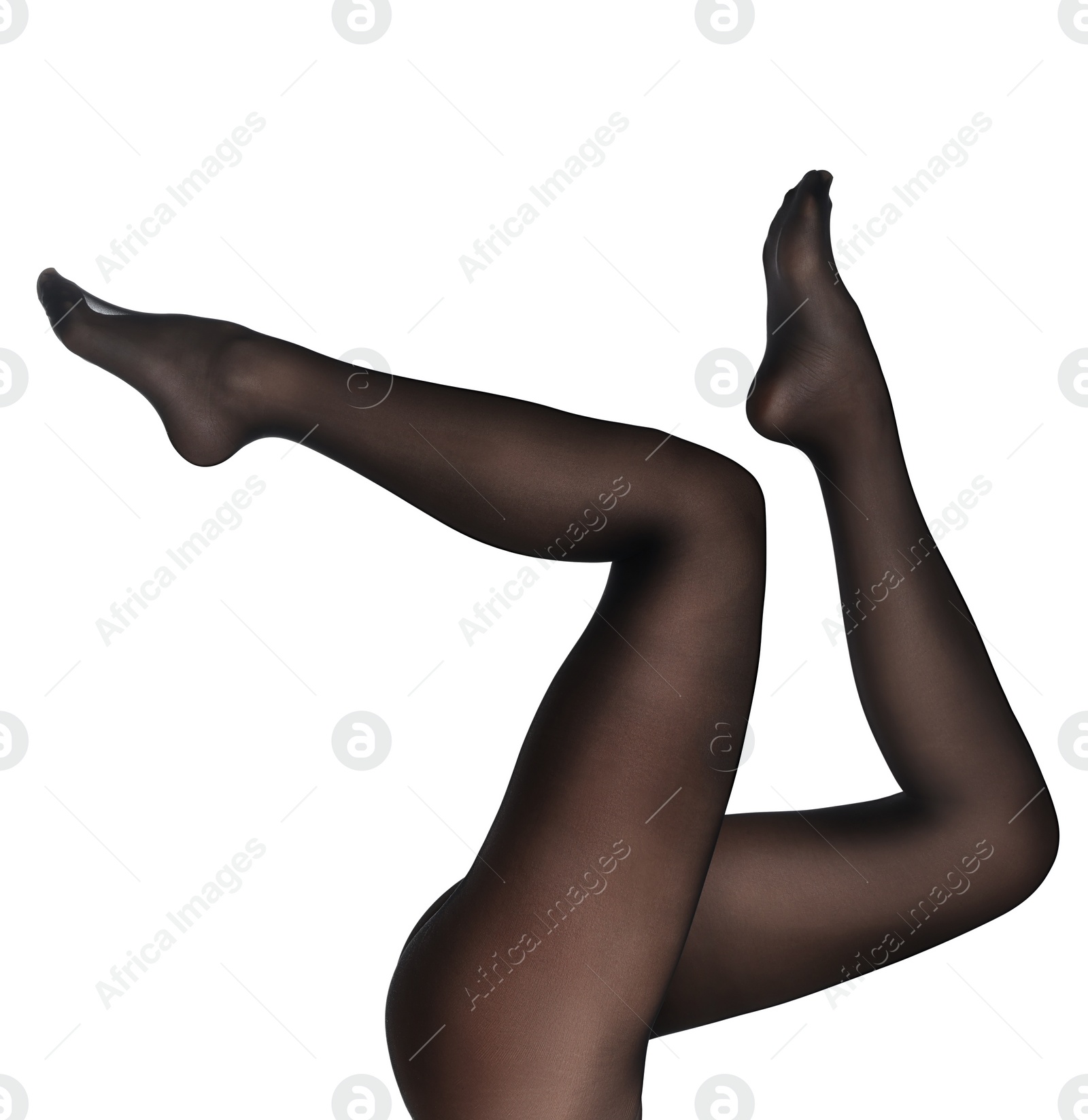 Photo of Woman with beautiful long legs wearing black tights on white background, closeup