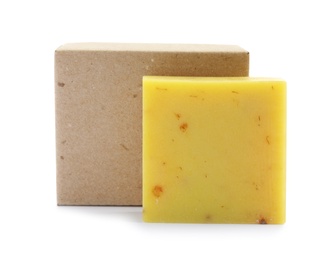 Hand made soap bar and cardboard package on white background