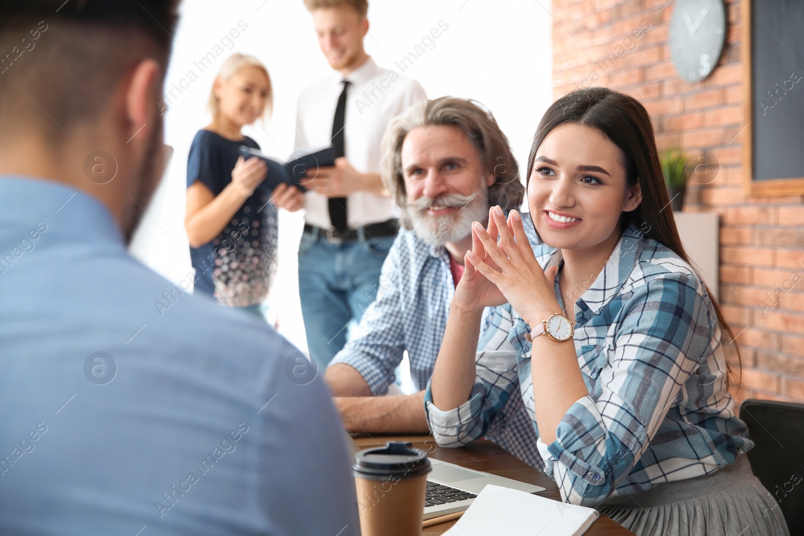 Photo of Business people interviewing candidate in office. Professional communication